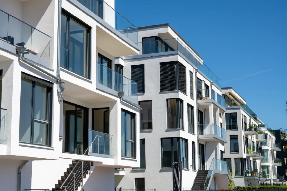 white modern multifamily complex with balconies